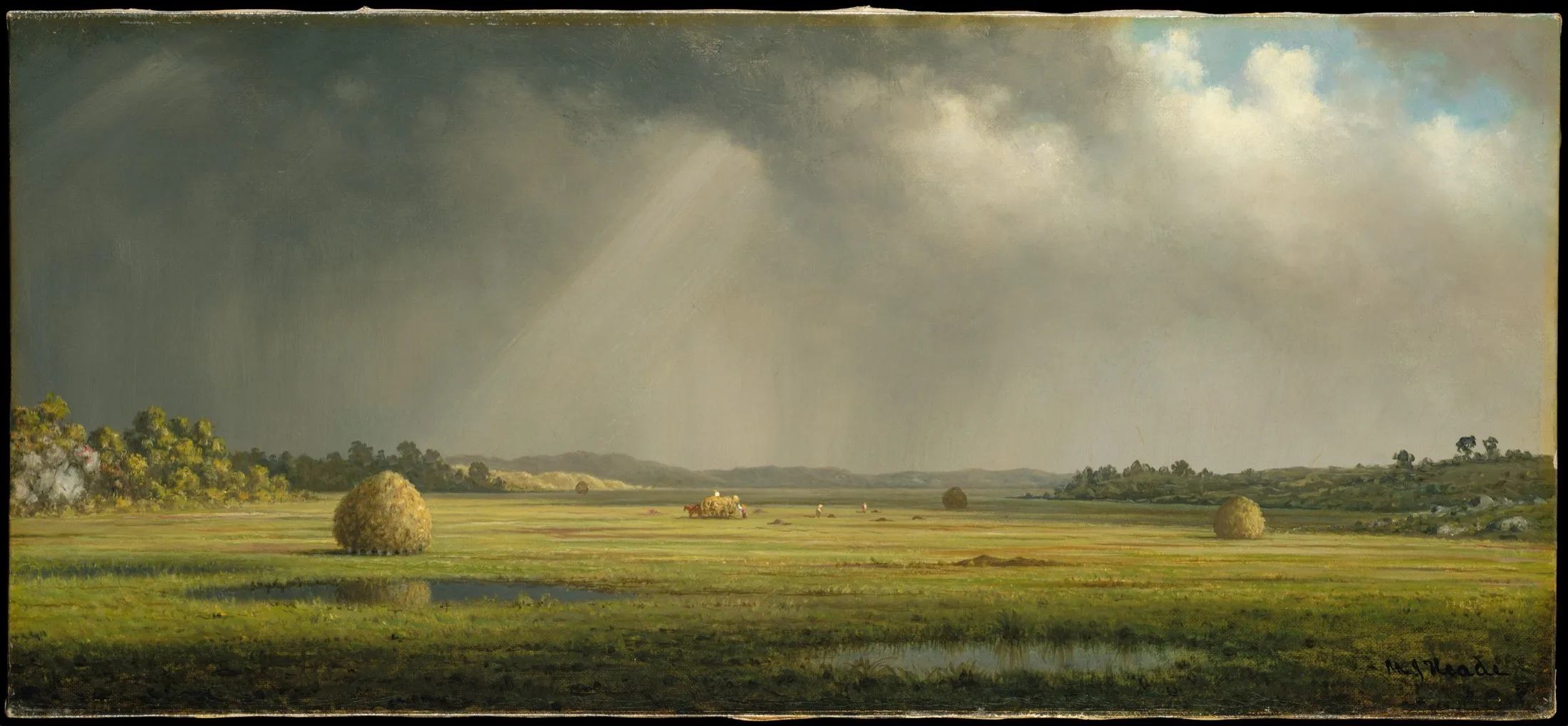 Flat green meadows with haystacks under a dark sky, lit by a break in the clouds.